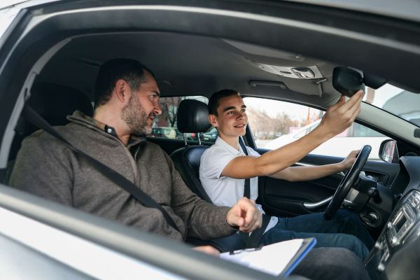 Friendly Right Route instructor coaching a smiling student